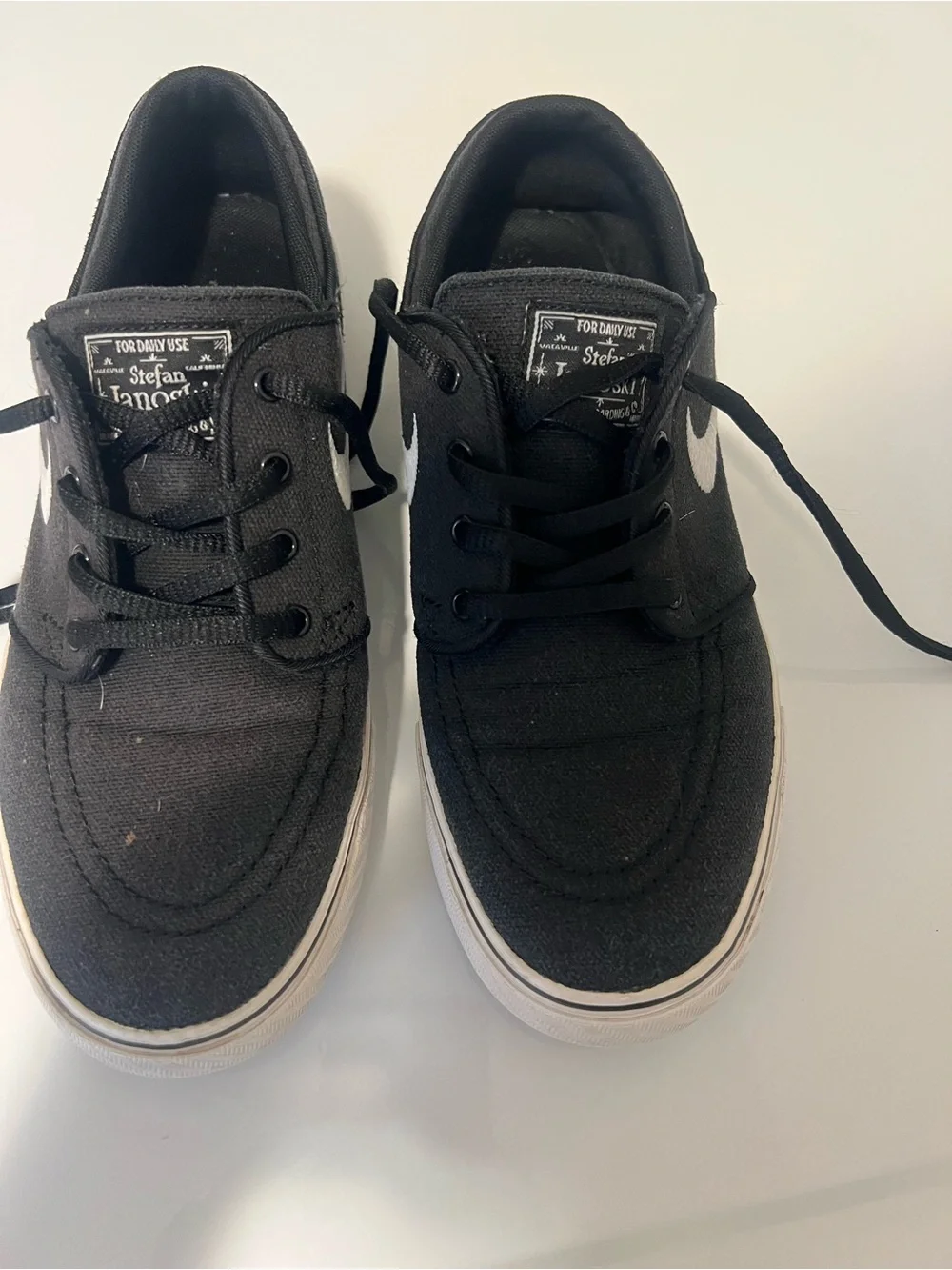 Nike Black Low-Top Sneakers with White Swoosh